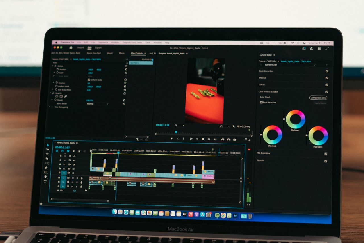 Close-up of video editing software on a laptop screen in a professional setting.